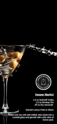 an image of a martini with olives in it