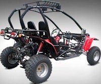 a red and black go - kart on a gray background