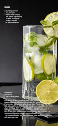 a glass of mojito with lime and ice
