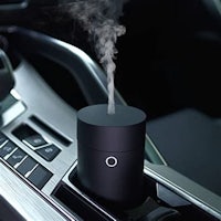a car air freshener with smoke coming out of it