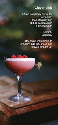 a picture of a cocktail with raspberries in it